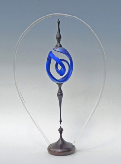 Sycamore. 350 mm high. Egg shape turned and carved, blackwood finials added T & B. Ref 10.32