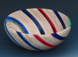 Beech plywood with 2 and 5mm thick coloured acrylic sheets. 145mm diameter. Ref 12.06