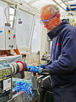 Turning a coloured resin bowl.