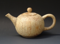 Spalted wood. 110 mm diameter. Hollow form with lid, carved spout & handle. Ref 17.08