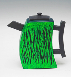 Sycamore. 140mm wide x 75 mm deep x 135mm high. Turned on 5 axes, some using thermed method to turn 2 teapots at once and maintain balance. Textured with motorised carver, ebonised , then overpainted in 2 shades of green. Ref 20.11