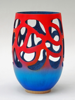 Sycamore. 150 mm high. Red & blue airbrushed outside between cut outs that include one heart shape. Sponge blues inside. Ref 19.23