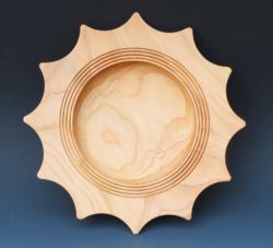 Cedar. 250 mm diameter. Star shaped rim. Ref 19.13