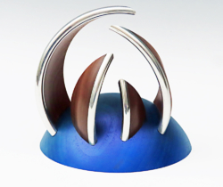 Sculpture with pieces from pewter rimmed sycamore bowl. 130mm wide. Ref. 23.6